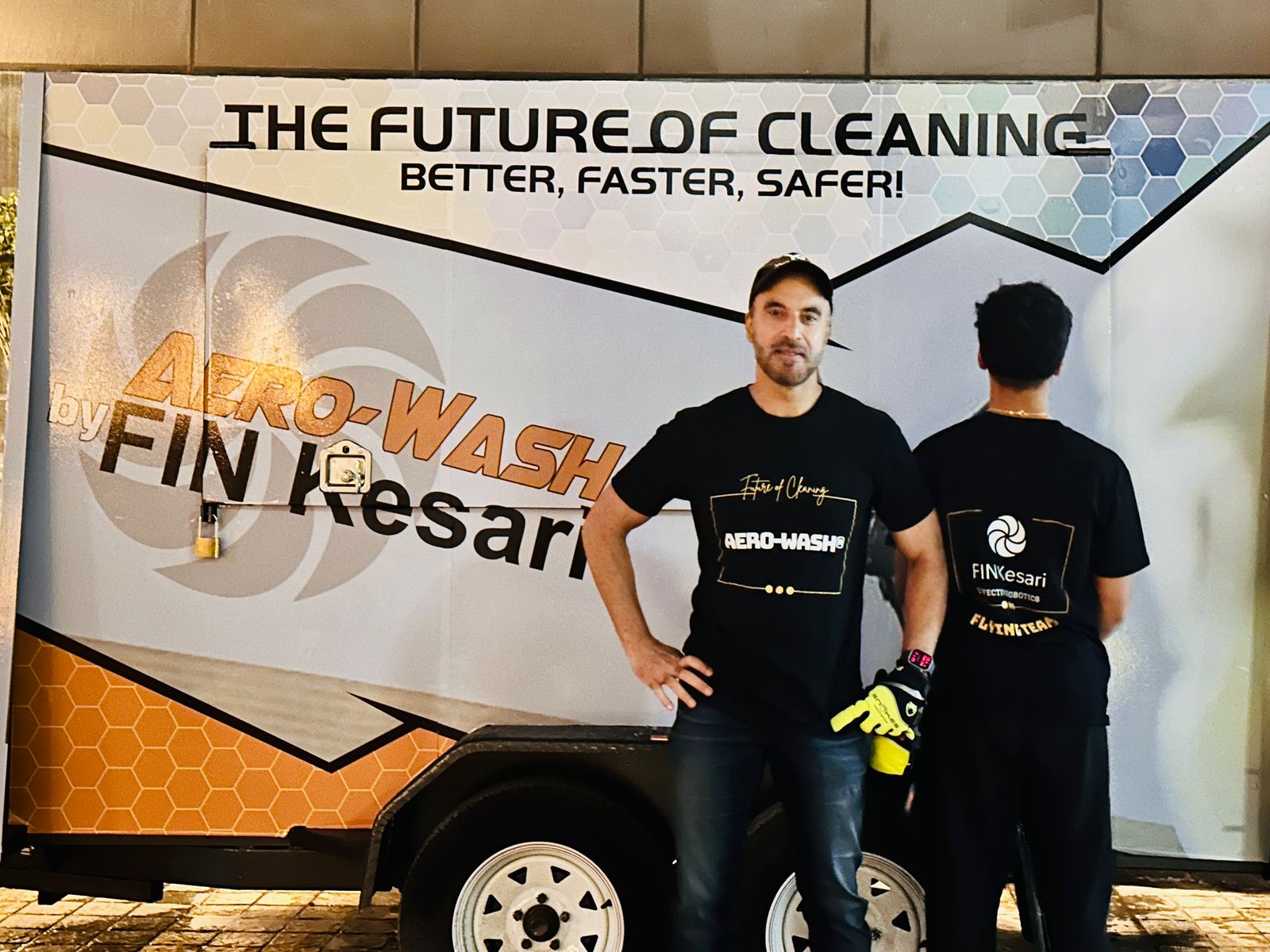 Fin Kesari crew standing in front of the Aero-Wash® trailer